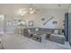Open concept living room and dining area features vaulted ceilings and a view into the kitchen at 4179 Hibiscus Dr. # 303, Little River, SC 29566