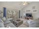 Comfortable living room features a vaulted ceiling, stylish decor, and access to an outdoor balcony at 4179 Hibiscus Dr. # 303, Little River, SC 29566