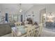 Open-concept living area features a vaulted ceiling, adjacent dining area, and a sliding glass door to the outdoors at 4179 Hibiscus Dr. # 303, Little River, SC 29566
