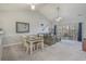 Bright living room with vaulted ceilings, dining area, and sliding glass doors to a balcony at 4179 Hibiscus Dr. # 303, Little River, SC 29566