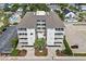 Aerial view of condo building with balconies and swimming pool at 4604 S Ocean Blvd. S # 1B, North Myrtle Beach, SC 29582