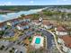 An aerial view of a condo community featuring a pool, waterfront access, and lush landscaping at 4648 Greenbriar Dr. # D7, Little River, SC 29566