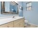 Well-lit bathroom with a single sink vanity, neutral walls, and window at 470 Springlake Dr., Myrtle Beach, SC 29579