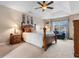 Comfortable bedroom showcasing a tray ceiling, large window, and stylish furniture at 470 Springlake Dr., Myrtle Beach, SC 29579