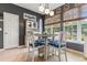 Charming dining area with gray walls, a round table with blue patterned chairs, and natural light from the windows at 470 Springlake Dr., Myrtle Beach, SC 29579