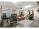 Organized garage featuring a comfortable sitting area and functional workspace at 470 Springlake Dr., Myrtle Beach, SC 29579