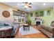 Inviting living room featuring hardwood floors, comfortable seating, a fireplace, and ample natural light at 470 Springlake Dr., Myrtle Beach, SC 29579