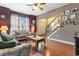 Inviting living room with hardwood floors, ceiling fan, and staircase with white railing at 470 Springlake Dr., Myrtle Beach, SC 29579