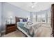 Bright bedroom with sitting nook, wood furniture and a ceiling fan at 4865 Luster Leaf Circle # 304, Myrtle Beach, SC 29577