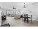 Bright living room featuring hardwood floors, comfortable seating, neutral paint, a ceiling fan, and sliding glass doors to a balcony at 4865 Luster Leaf Circle # 304, Myrtle Beach, SC 29577