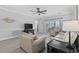 Cozy living room featuring hardwood floors, comfortable seating, neutral paint, and sliding glass doors to a balcony at 4865 Luster Leaf Circle # 304, Myrtle Beach, SC 29577