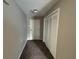 Neutral hallway with closet and door, providing a simple transition into the home at 5001 Little River Rd. # E-312, Myrtle Beach, SC 29577
