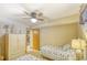 Cozy bedroom features twin beds, a ceiling fan and access to a staircase at 5507 N Ocean Blvd. # 304, Myrtle Beach, SC 29577