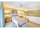 Comfortable bedroom with neutral decor, ceiling fan, and ensuite bathroom at 5507 N Ocean Blvd. # 304, Myrtle Beach, SC 29577
