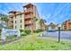 Condo building featuring several stories with parking and tropical landscaping and nearby vacation condo buildings at 5507 N Ocean Blvd. # 304, Myrtle Beach, SC 29577