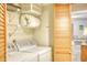 Convenient laundry room with washer, dryer, and storage shelving at 5507 N Ocean Blvd. # 304, Myrtle Beach, SC 29577