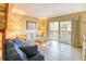 Inviting living room with sliding glass doors to a balcony, comfortable seating, and a bright, airy atmosphere at 5507 N Ocean Blvd. # 304, Myrtle Beach, SC 29577