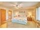 Bright main bedroom features a ceiling fan, ensuite bathroom and nautical themed decor at 5507 N Ocean Blvd. # 304, Myrtle Beach, SC 29577