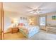 Comfortable bedroom featuring a ceiling fan, coastal decor, and a window for natural light at 5507 N Ocean Blvd. # 304, Myrtle Beach, SC 29577