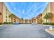 Condominium parking lot with palm trees and balconies under a sunny blue sky at 5507 N Ocean Blvd. # 304, Myrtle Beach, SC 29577