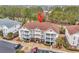 Well-maintained building exterior featuring multiple balconies and ample parking at 5750 Oyster Catcher Dr. # 533, North Myrtle Beach, SC 29582