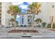 Modern exterior building with a well maintained landscape, enhanced by the vibrant palm trees at 5750 Oyster Catcher Dr. # 533, North Myrtle Beach, SC 29582