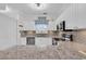 A modern kitchen boasts stainless steel appliances, stone countertops, and ample white cabinetry at 5750 Oyster Catcher Dr. # 533, North Myrtle Beach, SC 29582