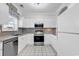 Bright kitchen with stainless steel appliances, granite countertops, and white cabinets at 5750 Oyster Catcher Dr. # 533, North Myrtle Beach, SC 29582