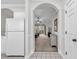 Light, airy living room with doorway to the kitchen and sliding glass door access to the deck at 5750 Oyster Catcher Dr. # 533, North Myrtle Beach, SC 29582