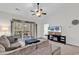 Cozy living room featuring a comfortable sofa, ceiling fan, and sliding glass doors to a balcony at 5750 Oyster Catcher Dr. # 533, North Myrtle Beach, SC 29582