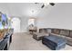 Bright living room with neutral carpet, ceiling fan, large sectional sofa, and dining area at 5750 Oyster Catcher Dr. # 533, North Myrtle Beach, SC 29582