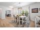 Bright dining room features wood floors, modern light fixture, and a view into the office at 5987 Tramonto St., Myrtle Beach, SC 29577