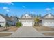 Charming single-story home with a two-car garage, manicured lawn, and inviting curb appeal at 5987 Tramonto St., Myrtle Beach, SC 29577