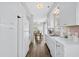 Galley kitchen with white appliances, sleek countertops, and seamless flow to the dining area at 6001- 1084 S Kings Highway, Myrtle Beach, SC 29575