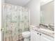 Bathroom with granite countertop, white cabinets and beach themed shower curtain at 6001-1383 S Kings Hwy., Myrtle Beach, SC 29575