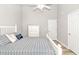 Comfortable bedroom has a vaulted ceiling, a dresser, and coastal-themed bedding at 6001-1383 S Kings Hwy., Myrtle Beach, SC 29575