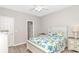 Bright bedroom features a queen bed with coastal-themed bedding and neutral walls at 6001-1383 S Kings Hwy., Myrtle Beach, SC 29575