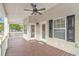 Spacious covered deck with wood flooring, ceiling fan, and views of the surrounding landscape at 6001-1383 S Kings Hwy., Myrtle Beach, SC 29575