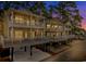 Exterior view of elevated coastal homes with large front porches at dusk at 6001-1383 S Kings Hwy., Myrtle Beach, SC 29575