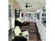 Relaxing covered porch featuring outdoor seating and a ceiling fan at 6001-1383 S Kings Hwy., Myrtle Beach, SC 29575