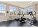 Well-lit home gym with windows and modern exercise equipment at 6514 Anchors Bend Dr Sw, Ocean Isle Beach, NC 28469