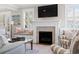 Relaxing living room featuring a fireplace, built-in seating, and stylish accents at 6514 Anchors Bend Dr Sw, Ocean Isle Beach, NC 28469