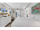 Cozy bedroom with flamingo art, white furniture, and tv at 6804 N Ocean Blvd. # 1623, Myrtle Beach, SC 29572