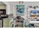 Eat-in kitchen with breakfast nook and retro beach-themed art at 6804 N Ocean Blvd. # 1623, Myrtle Beach, SC 29572