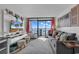 Bright living room with a view of the ocean and balcony access at 6804 N Ocean Blvd. # 1623, Myrtle Beach, SC 29572