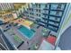 Aerial view of a building featuring a pool surrounded by lounge chairs at 6804 N Ocean Blvd. # 1623, Myrtle Beach, SC 29572