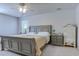 Serene bedroom featuring a comfortable bed, ceiling fan, and soothing color palette at 693 Landmark Cove Rd., Carolina Shores, NC 28467