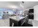 Open kitchen with a breakfast bar, stainless steel appliances, and stylish pendant lighting at 693 Landmark Cove Rd., Carolina Shores, NC 28467