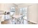 Cozy dining area with natural light, modern light fixture, and access to the backyard at 707 Culbertson Ave., Myrtle Beach, SC 29577