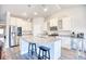 Well-lit kitchen showcases granite countertops, stainless steel appliances, and a central island with barstools at 707 Culbertson Ave., Myrtle Beach, SC 29577